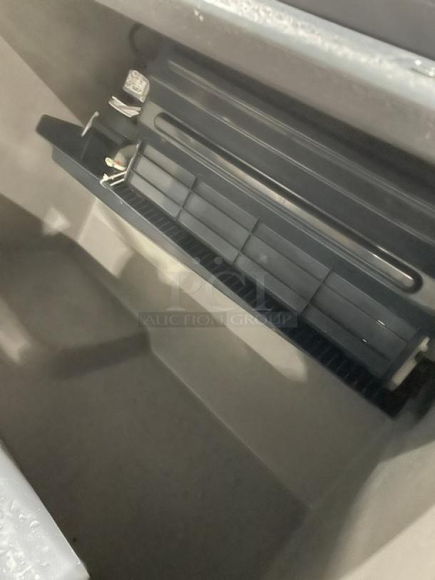 Scotsman Prodigy Series CU3030SW1E undercounter ice maker, stainless steel, electric, water-cooled, on legs, interior view.