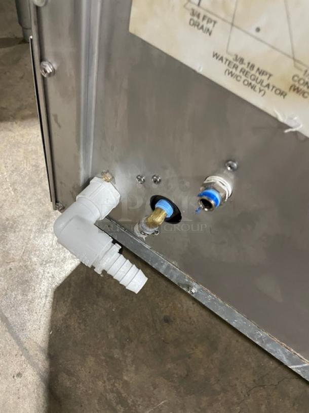 Scotsman Prodigy Series ice maker, model CU3030SW-1E. Undercounter, stainless steel, on legs, visible water connections.