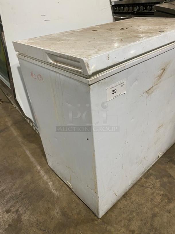 Haier commercial white chest freezer, model HE71CL53NW. Top hinged lift-up lid. Some exterior wear. Quantity tag marked "29".