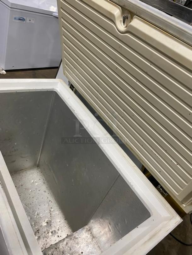 Haier white chest freezer, model HE71CL53NW, with lift-up lid open. Appears gently used; interior clean. 115V, 1 phase.