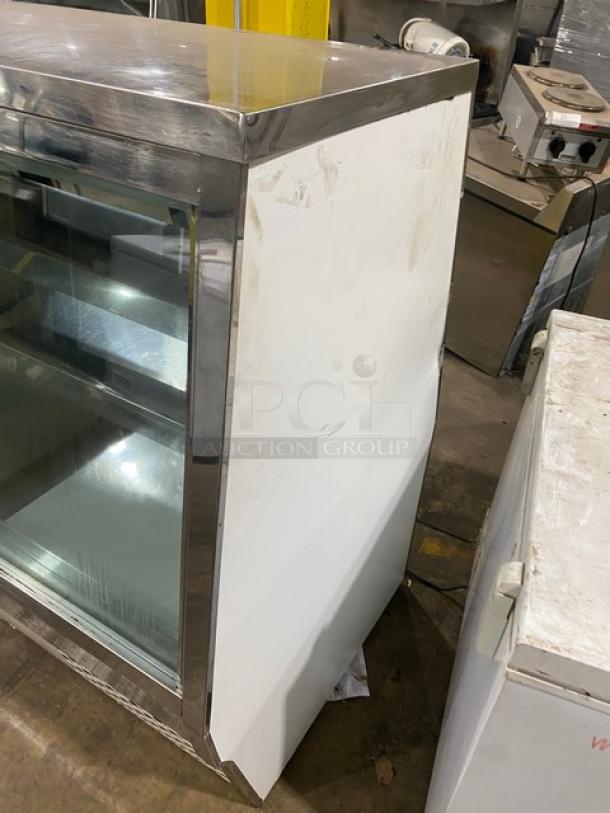 Custom Cool stainless steel refrigerated deli merchandiser, model DEL4SC, with slanted glass display and lower storage.