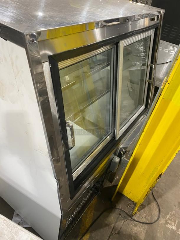 Custom Cool stainless steel deli merchandiser, slanted glass, Model DEL4SC, with sliding doors and lower storage, 115V 1 Phase.