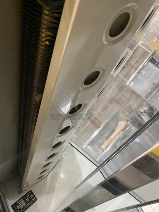 Custom Cool commercial stainless steel refrigerated deli display, Model DEL4SC, with slanted glass and double sliding doors.