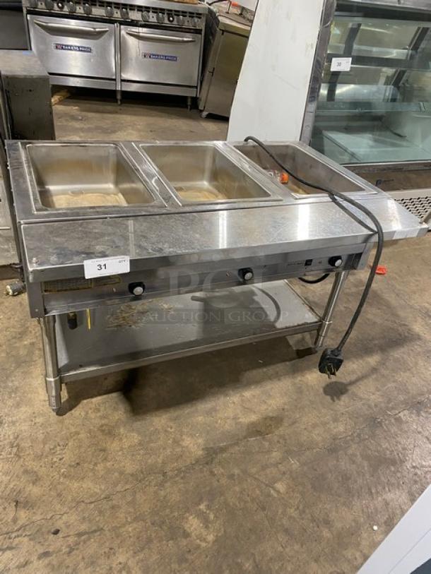 Eagle Group commercial stainless steel 3-well hot food/steam table, electric, tray slide, single undershelf, on legs.