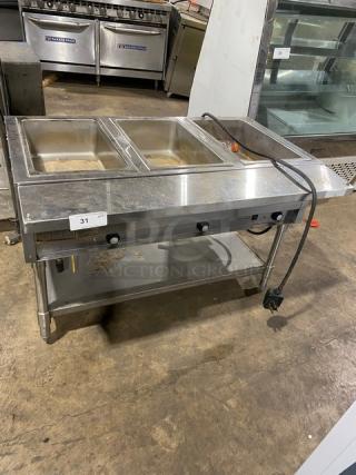 Eagle Group commercial stainless steel 3-well hot food/steam table, electric, tray slide, single undershelf, on legs.