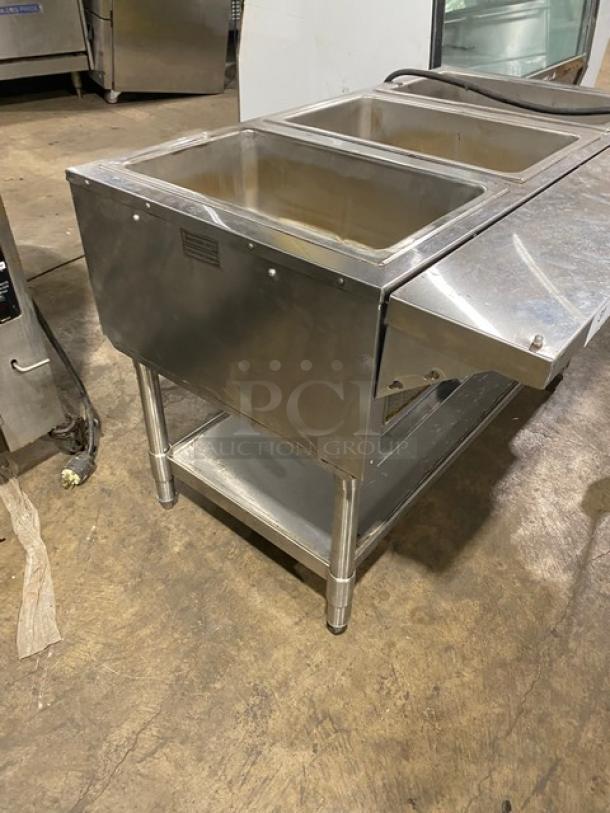 Eagle Group 3-well stainless steel hot food table with tray slide, single undershelf, on legs, in good condition.
