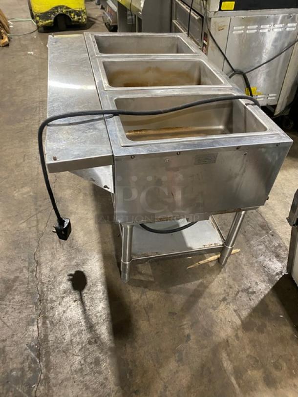 Eagle Group stainless steel 3-well steam table with tray slide, single undershelf, on legs, electric-powered, used condition.