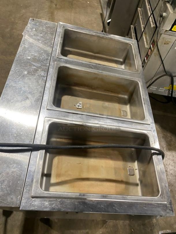 Eagle Group commercial stainless steel 3-well hot food steam table with tray slide, single undershelf, and sturdy legs.