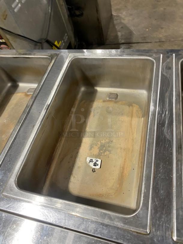 Eagle Group stainless steel 3-well hot food steam table, electric powered, with tray slide, single undershelf, on legs.