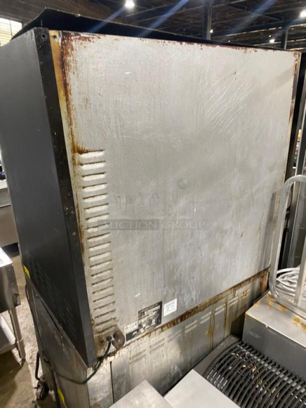Cleveland Range commercial stainless steel rotisserie oven, Model BMR-32, paired with hot food storage, visible wear.