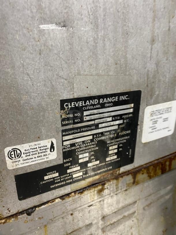 Cleveland Range serial number plate, showing model BMR-32 and BMW334. Signage indicates usage specifications and safety labels.