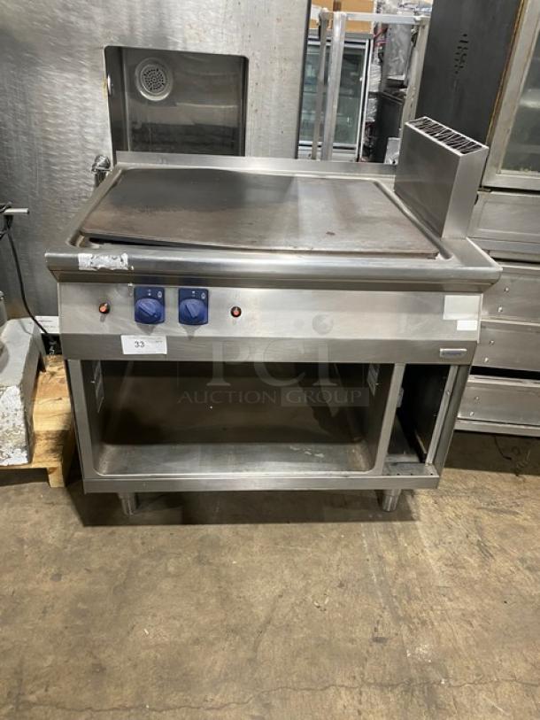 Electrolux Thermaline Series stainless steel flat top grill, natural gas, with enclosed open base, two dials, on legs, used condition.