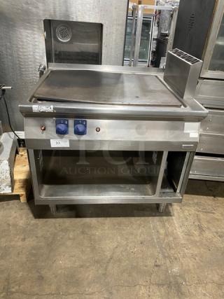 Electrolux Thermaline Series stainless steel flat top grill, natural gas, with enclosed open base, two dials, on legs, used condition.