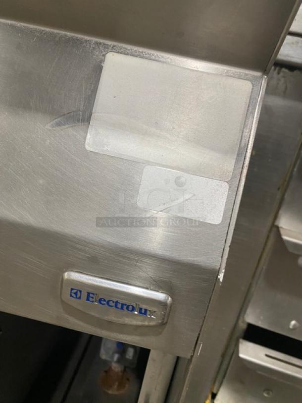 Electrolux Thermaline stainless steel gas flat top grill with enclosed open base, in good condition, visible Electrolux logo.