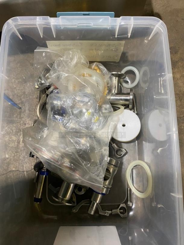 Vevor Commercial Stainless Steel Liquid Filling Machine with hopper and attachments in a clear storage bin.