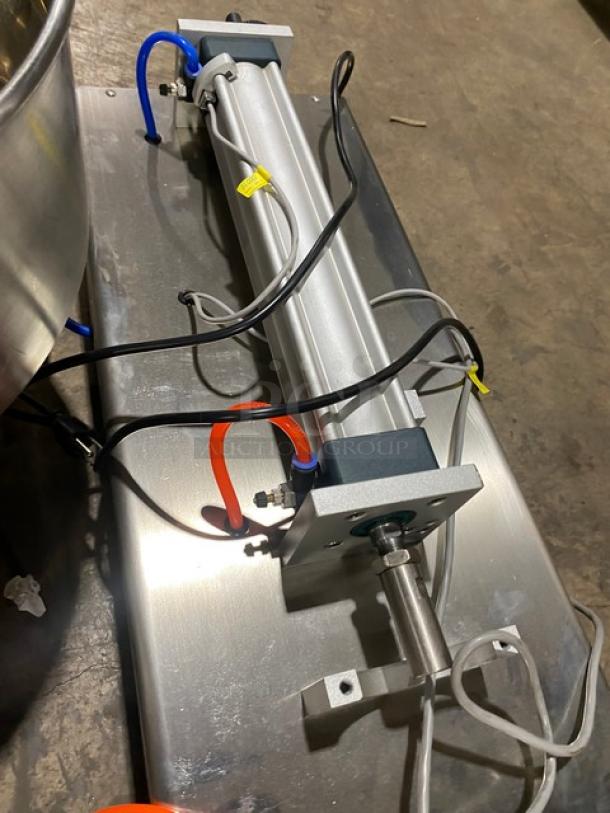 Vevor commercial electric countertop liquid filling machine with stainless steel hopper and attachments, shown in good condition.