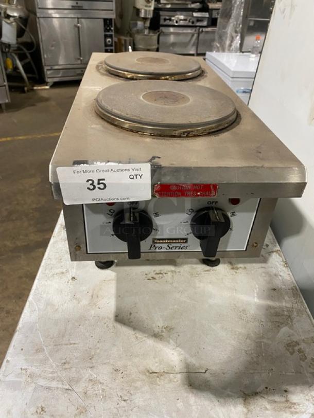 Toastmaster Pro-Series 2-burner countertop hot plate, model THPF, stainless steel, commercial use, auction tag visible.