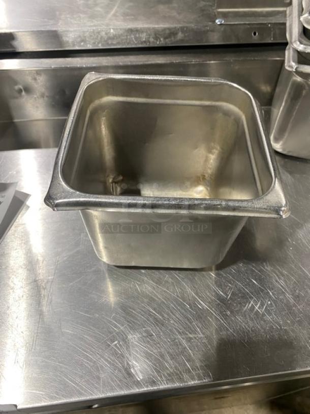 Commercial stainless steel steamtable pan, durable and deep, ideal for hotel use. Appears in good condition.