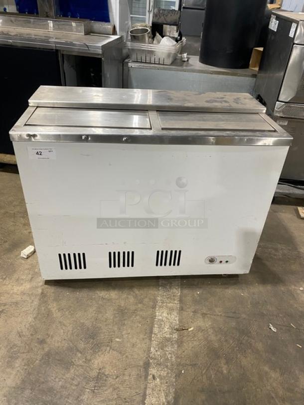 Summit Commercial 44" Back Bar Chest Cooler, Model SCFR100MAN. White, manual defrost, with double stainless steel sliding lids, on legs.