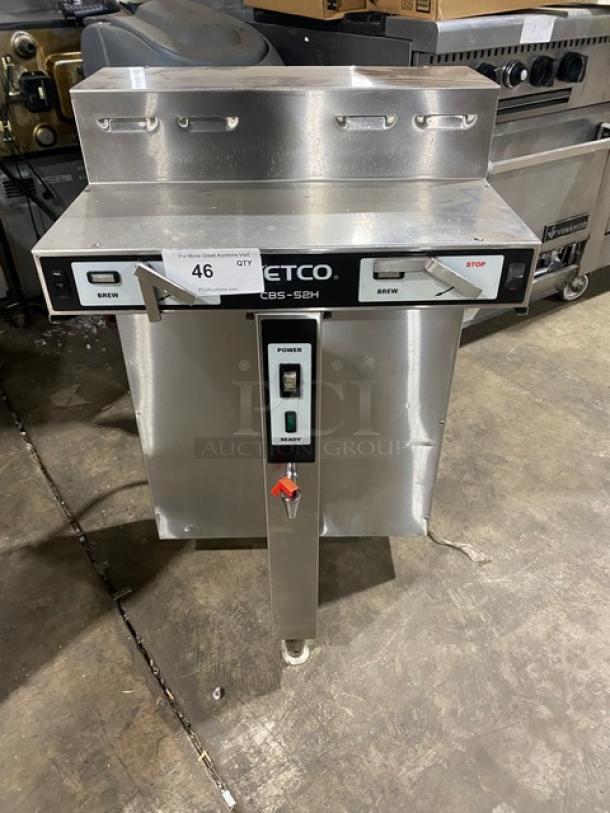 Fetco CBS52H15 stainless steel twin coffee brewer with hot water dispenser. Model CBS-52H15, in used condition, on legs.