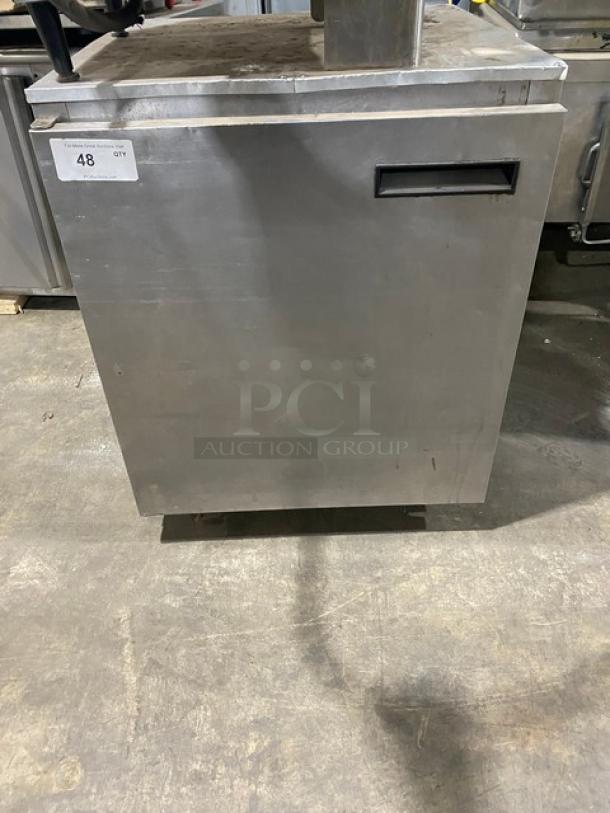 Commercial stainless steel single door undercounter refrigerator on casters, with poly-coated wired rack. Slight wear visible.