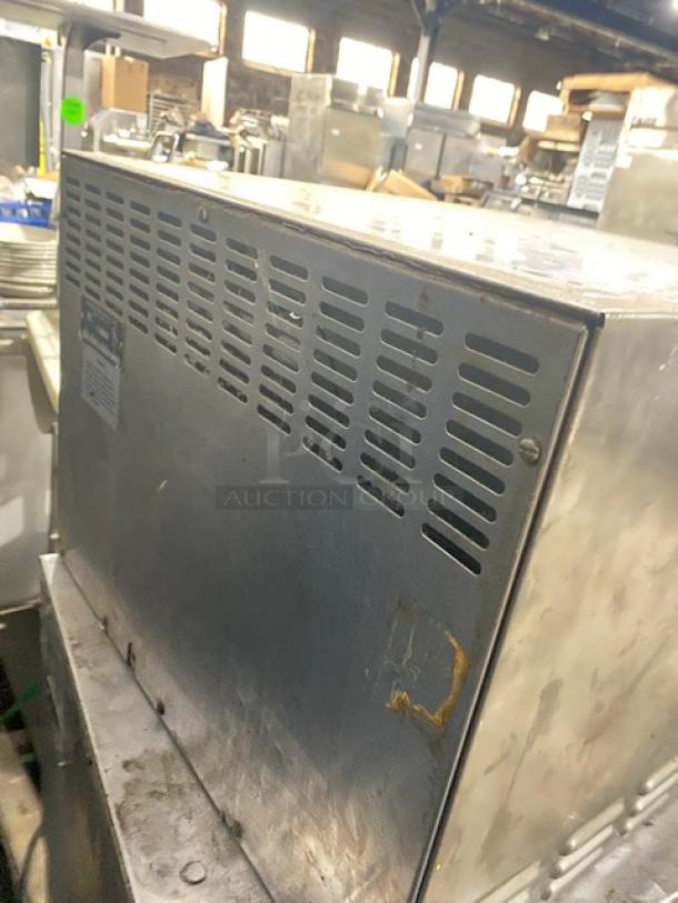 Bakers Pride P18 stainless steel electric countertop double deck pizza oven, visible wear, vented side panel.