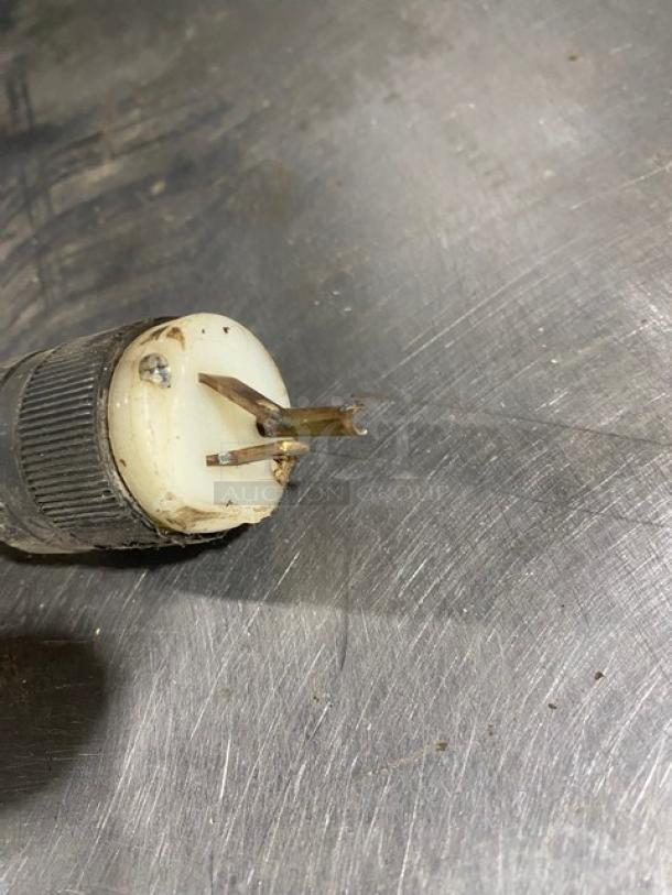 Bakers Pride P18 electric pizza oven plug detail on stainless steel surface.