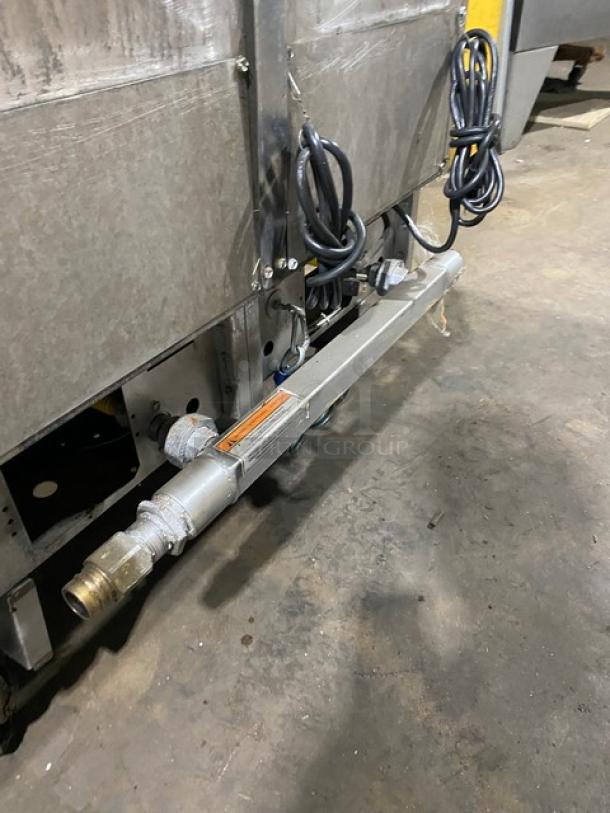 Pitco FG-SGH50 commercial deep fryer system, stainless steel, 4-bay, natural gas, on casters, with oil filter, used.