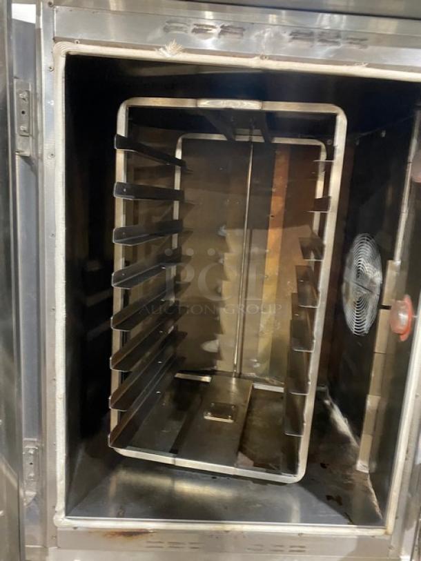 Baxter OV300G stainless steel natural gas convection oven with digital controls, 8-pan rotating rack, open-base storage, on casters.