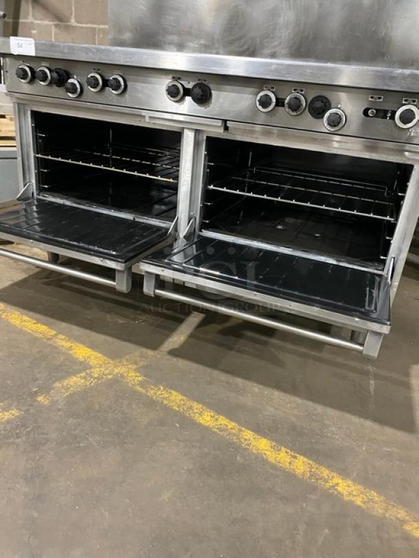 Garland H284 commercial stainless steel 10-burner range, double oven, overhead salamander shelf, wired rack, on legs.