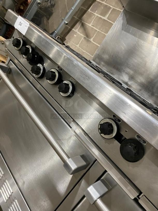 Garland H284 stainless steel 10-burner range with double oven and backsplash. Features overhead salamander shelf and wired oven rack.
