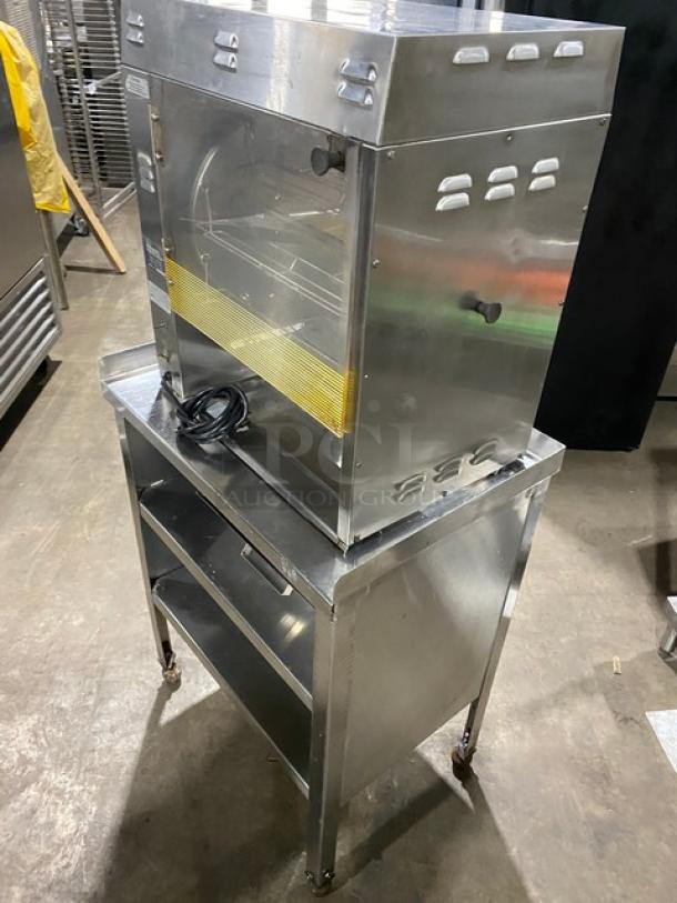 Prince Castle Model 413 stainless steel corn carousel, electric powered, on casters, with double undershelf equipment stand.