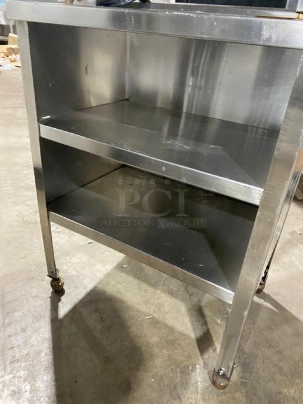 Prince Castle stainless steel electric corn carousel, model 413, double undershelf, on casters, 115V, used condition.