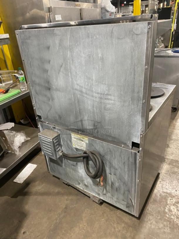 Imperial stainless steel electric 6-burner range/oven combo, back splash, overhead salamander shelf, wired oven rack, fair condition.