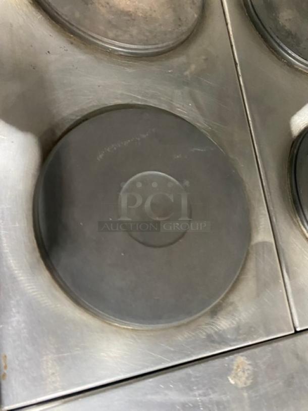 Imperial stainless steel 6-burner hot plate range/oven combo, features overhead salamander shelf, wired oven rack, used condition.