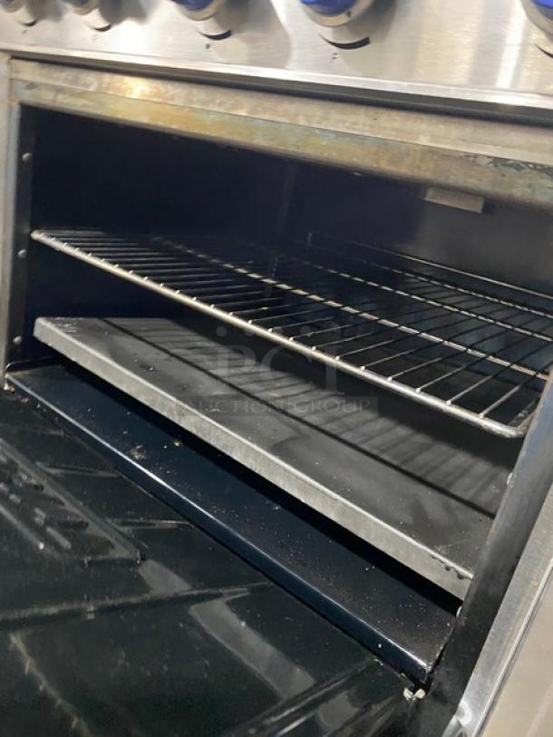 Imperial stainless steel 6-burner electric hot plate range/oven combo with backsplash, overhead salamander shelf, and wired oven rack.