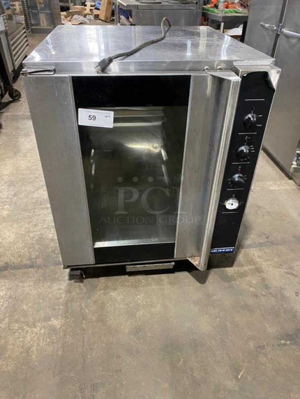 Moffat stainless steel electric convection oven with built-in pan slides, 115-120V, on casters, excellent condition.