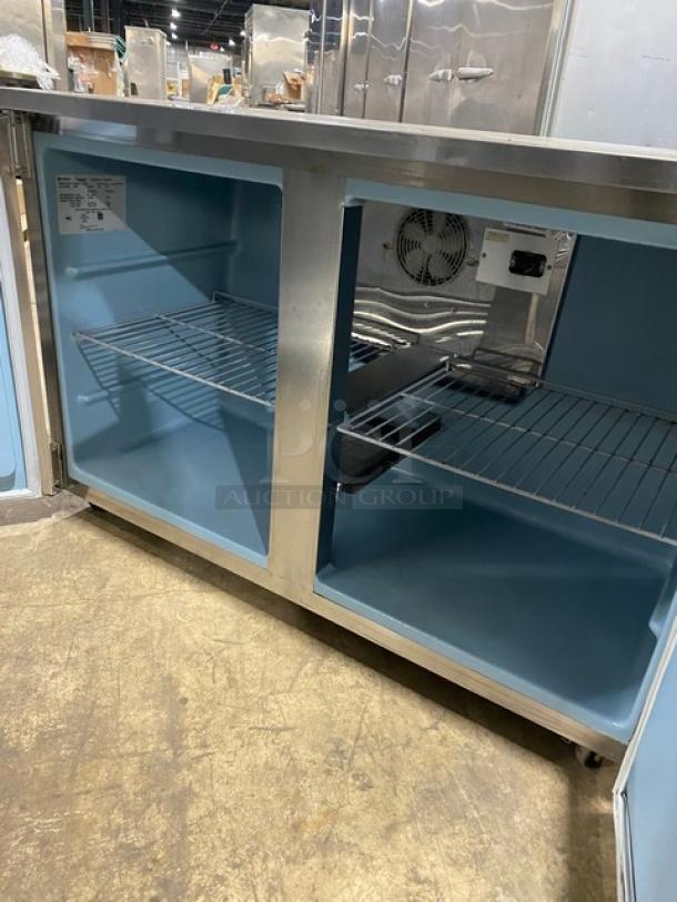 Delfield UC4048STAR 2-door refrigerated worktop table in stainless steel, Energy Star certified, with poly-coated wire rack.