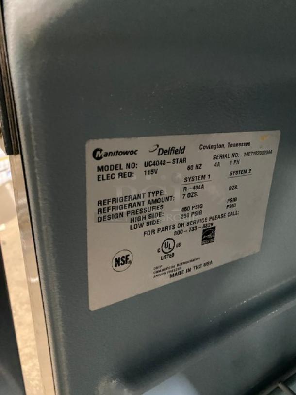 Delfield UC4048-STAR 2 Door Refrigerated Worktop Table, stainless steel, Energy Star certified, poly-coated wired rack, 115V, on casters, serial number 1407152002044.