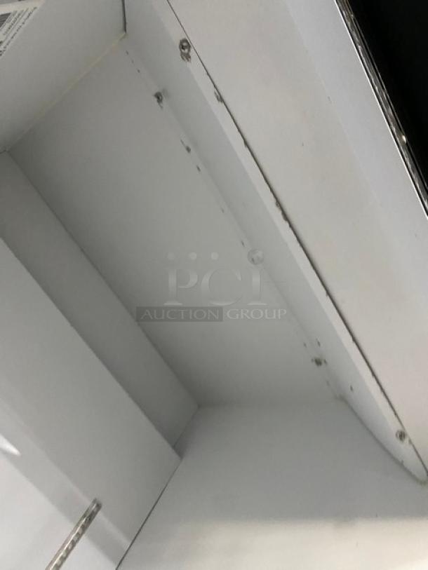Habco ESM28 commercial merchandiser fridge interior, single glass swing door, Energy Star Certified, good condition.