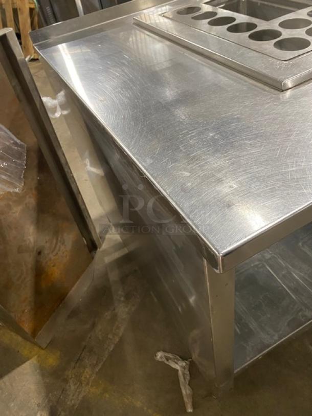 Custom stainless steel food prep table, single-well hot, 4-well cold, adapter plates, single undershelf, on legs, good condition.