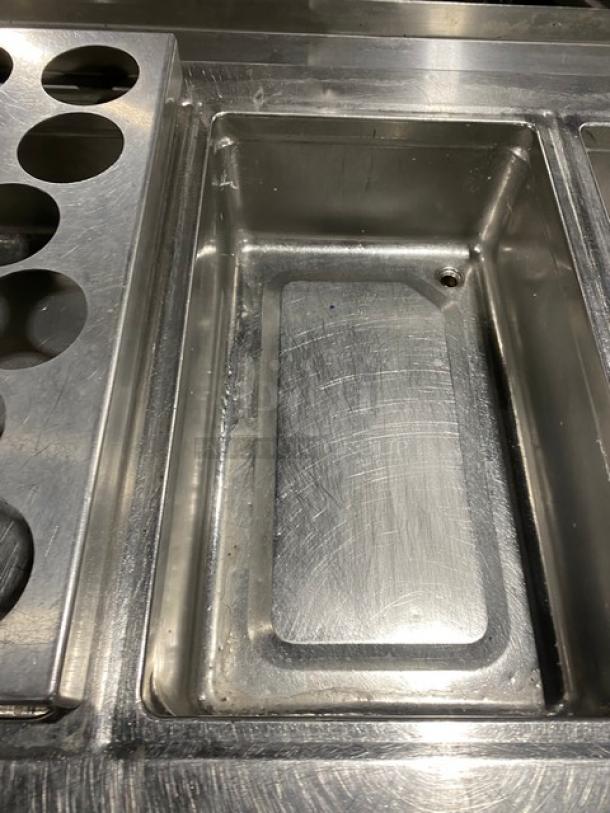 Custom stainless steel food prep table, single-well hot, four-well cold, adapter plates, undershelf, legs, good condition.