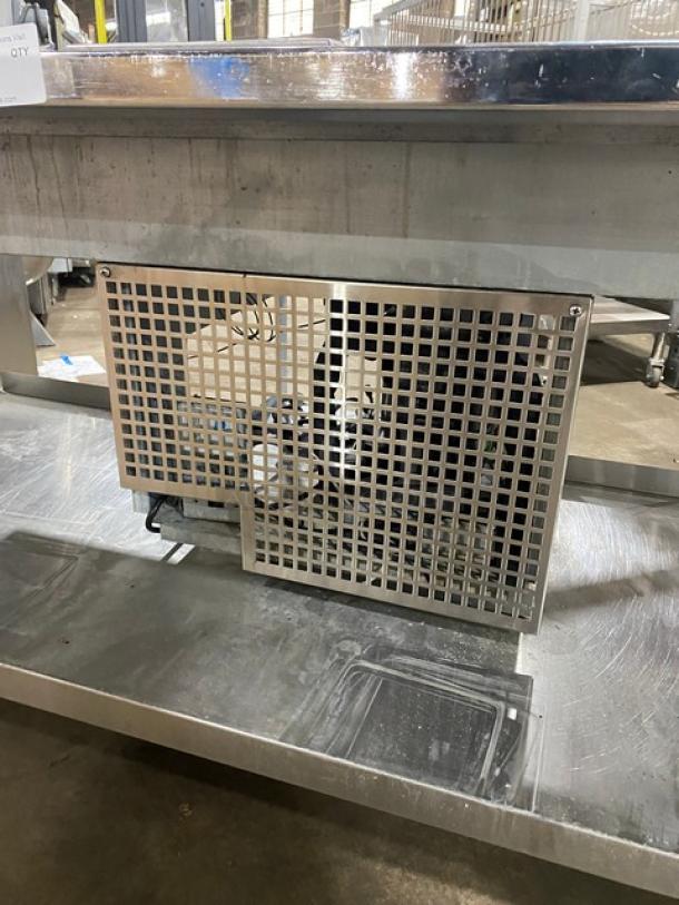 Custom stainless steel food prep table with single hot well, four cold wells, adapter plates, undershelf, and legs. Appears gently used.
