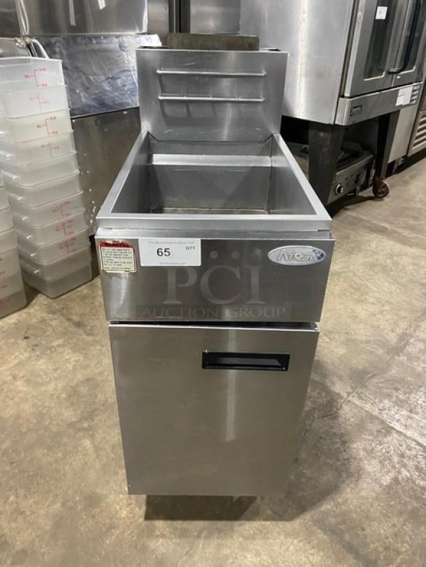 Atosa commercial stainless steel natural gas deep fat fryer with backsplash, basket hanger, and legs; tagged for auction.