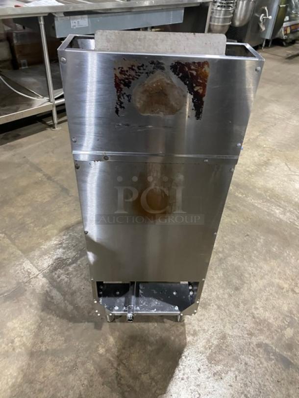 Atosa stainless steel deep fat fryer, natural gas powered, with backsplash, basket hanger, and legs. Visible wear on surface.