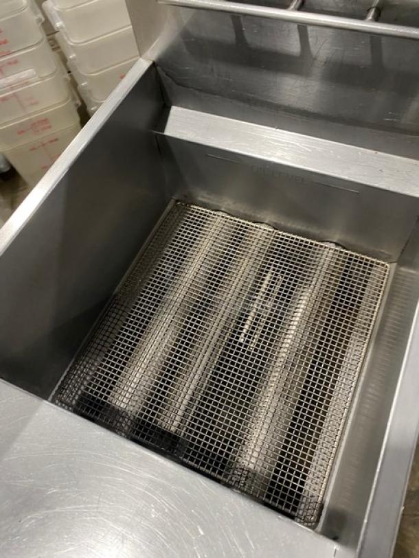 Atosa stainless steel natural gas deep fat fryer with backsplash and basket hanger, on legs. Clean, excellent condition.