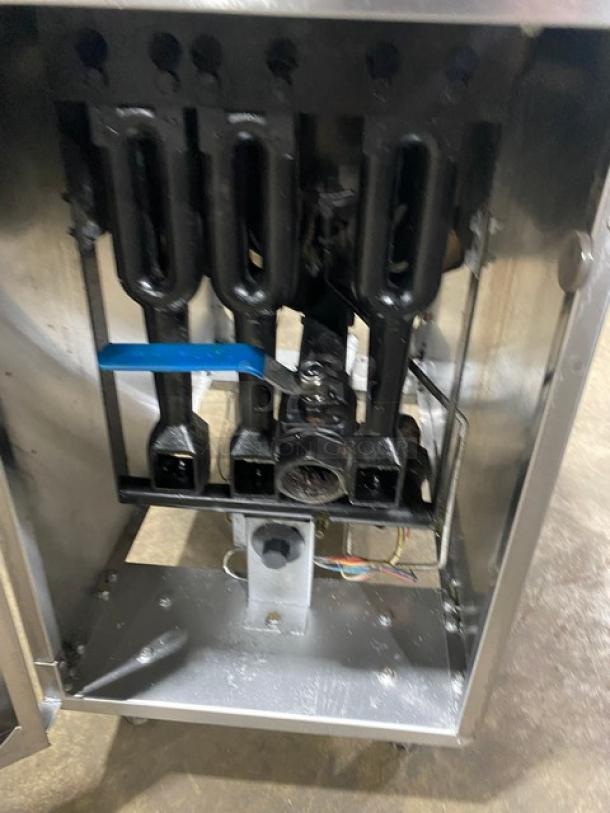Atosa commercial stainless steel natural gas deep fat fryer with back splash, basket hanger, and sturdy legs.