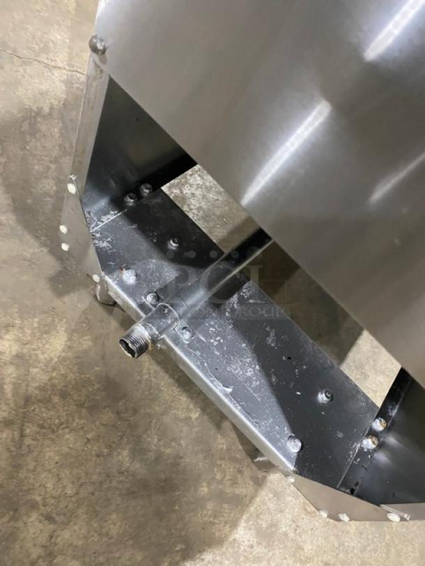 Atosa stainless steel natural gas deep fat fryer base with visible gas connection, back splash, and basket hanger.