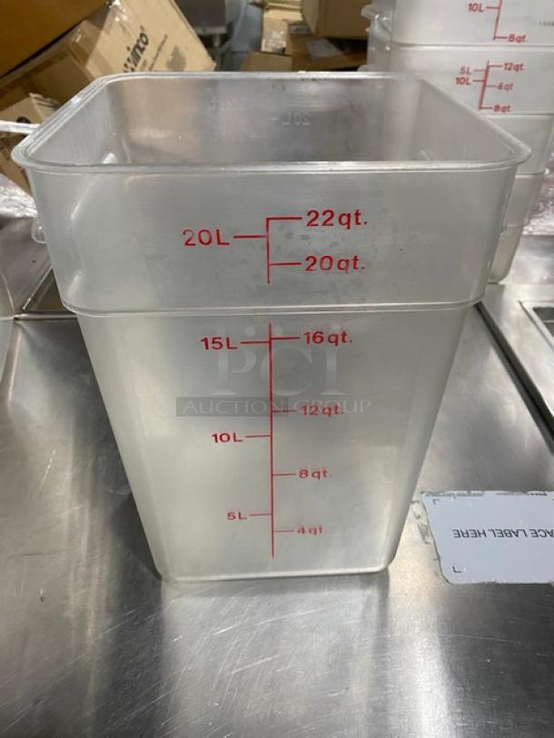 Cambro commercial clear polycarbonate 22 qt. food container, marked with red volume measurements in quarts and liters.