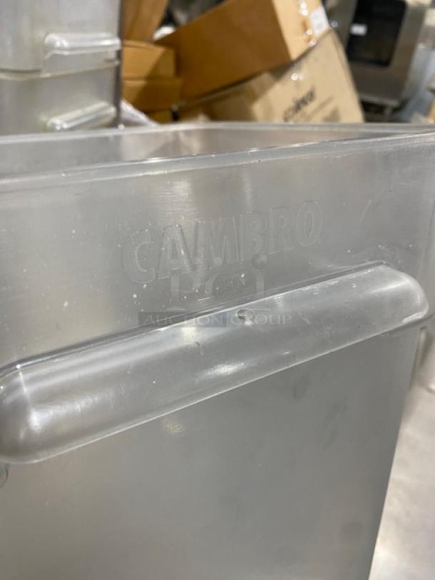 Cambro clear polycarbonate 22 Qt. food container, embossed logo, sturdy condition, suitable for commercial use.